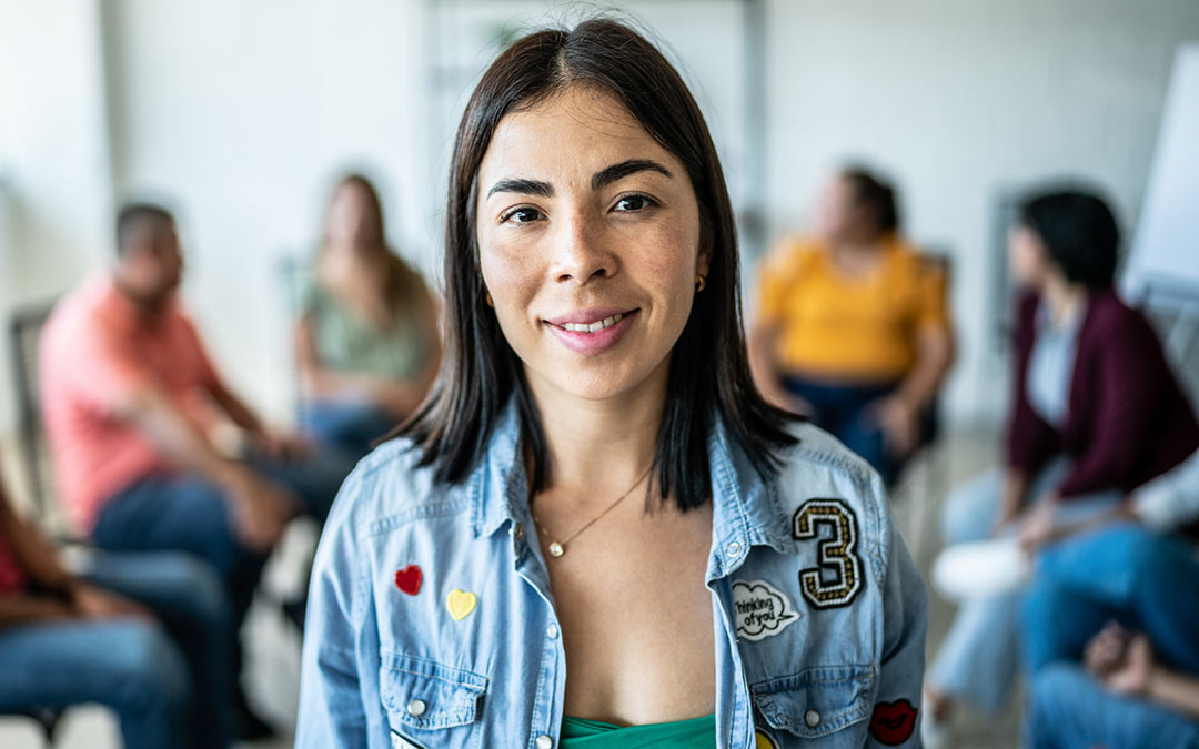 young Latina woman in group counseling session