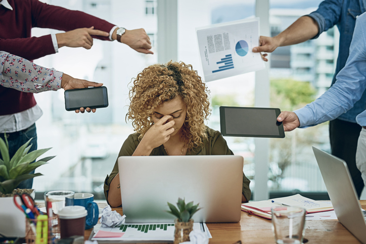 woman looking stressed out in office environment